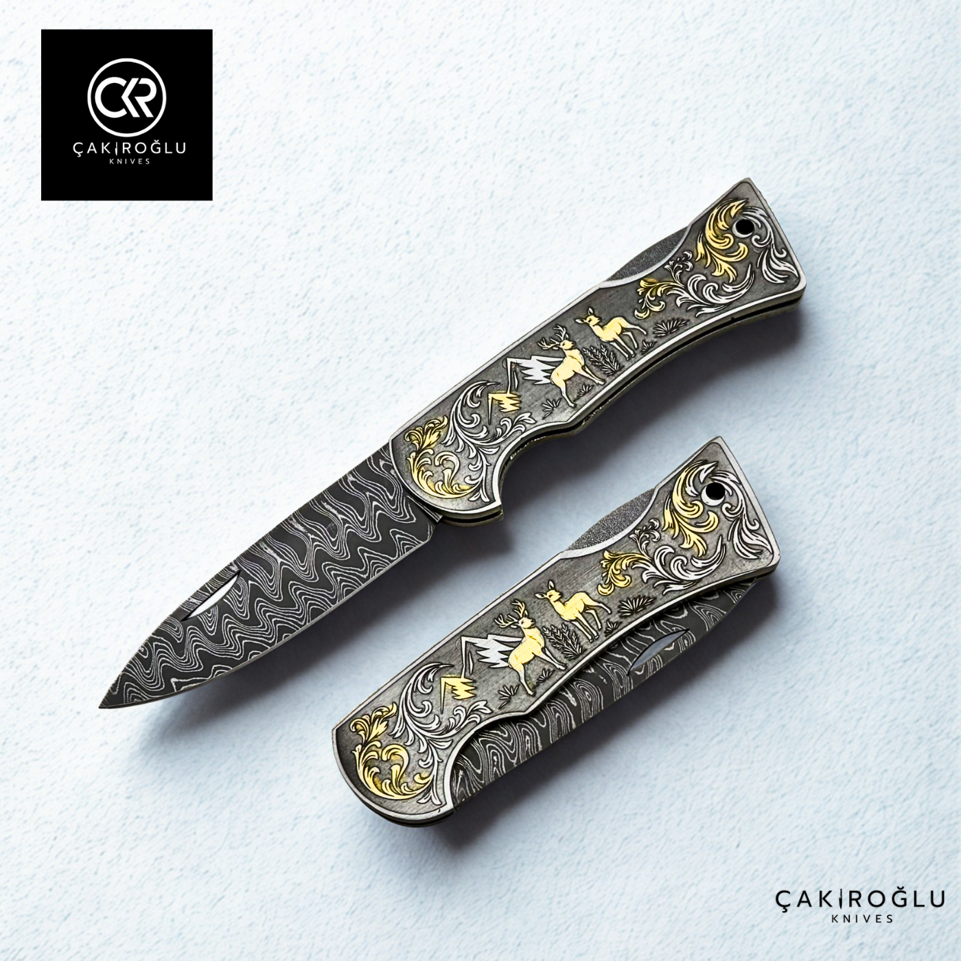 Corvus series Damascus - Limited Edition Collector's Folding Knife with 14K gold engraving details on a stainless steel case