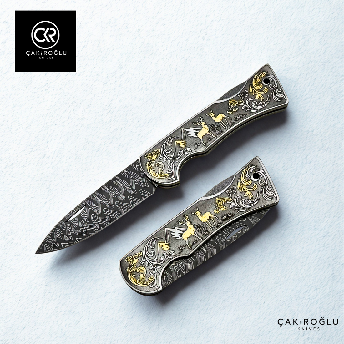 Corvus series Damascus - Limited Edition Collector's Folding Knife with 14K gold engraving details on a stainless steel case