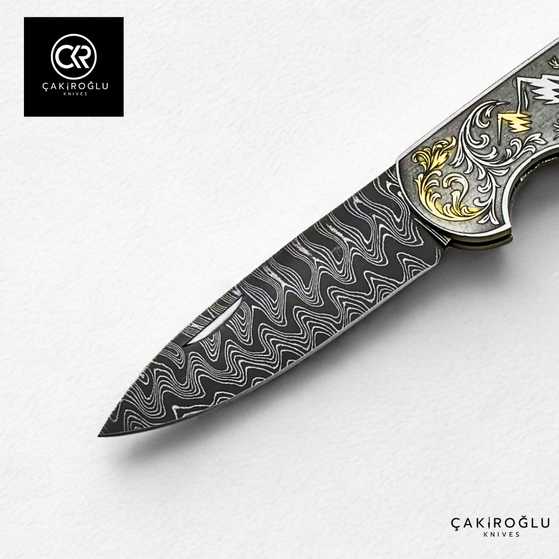 Corvus series Damascus - Limited Edition Collector's Folding Knife with 14K gold engraving details on a stainless steel case
