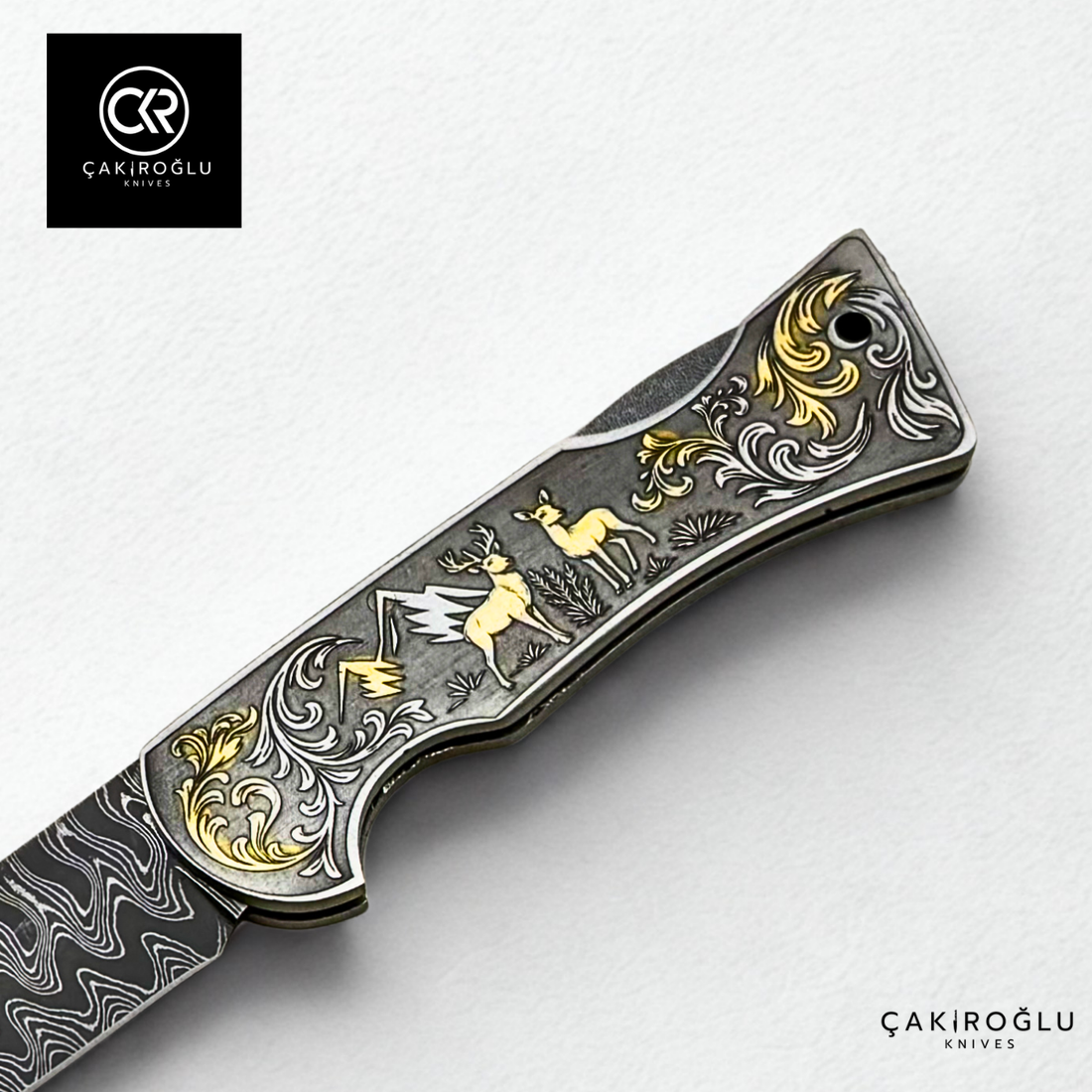 Corvus series Damascus - Limited Edition Collector's Folding Knife with 14K gold engraving details on a stainless steel case
