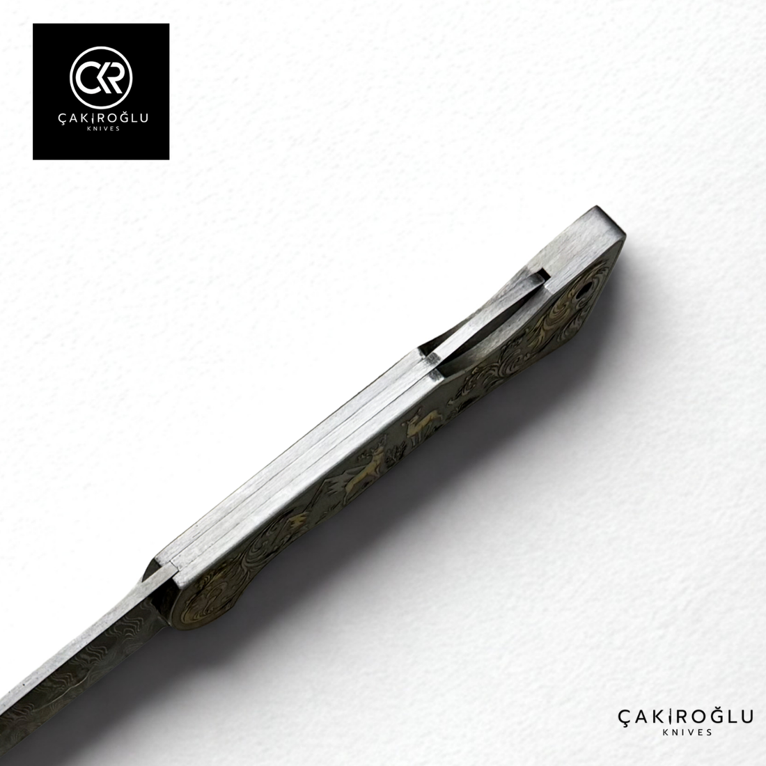 Corvus series Damascus - Limited Edition Collector's Folding Knife with 14K gold engraving details on a stainless steel case