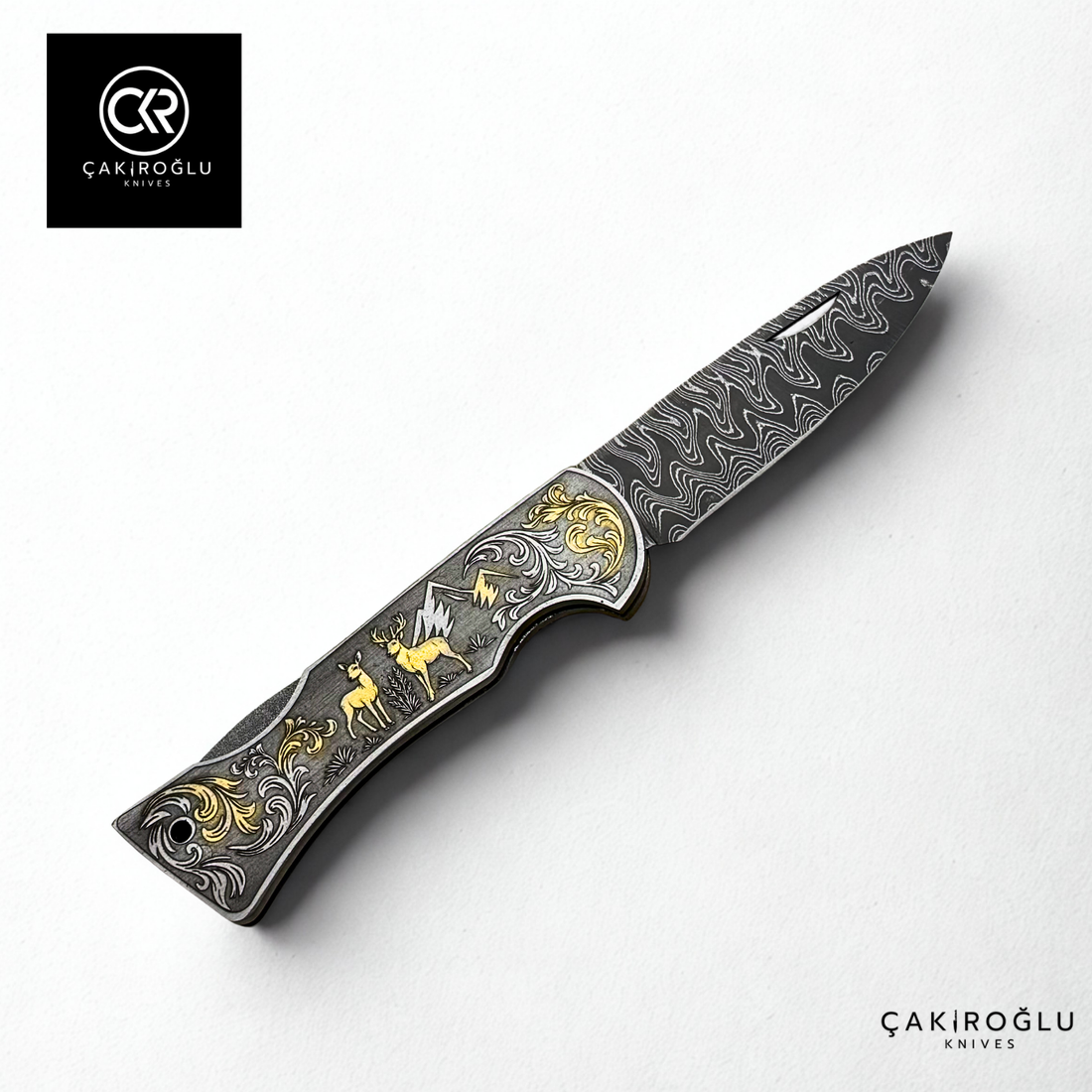 Corvus series Damascus - Limited Edition Collector's Folding Knife with 14K gold engraving details on a stainless steel case