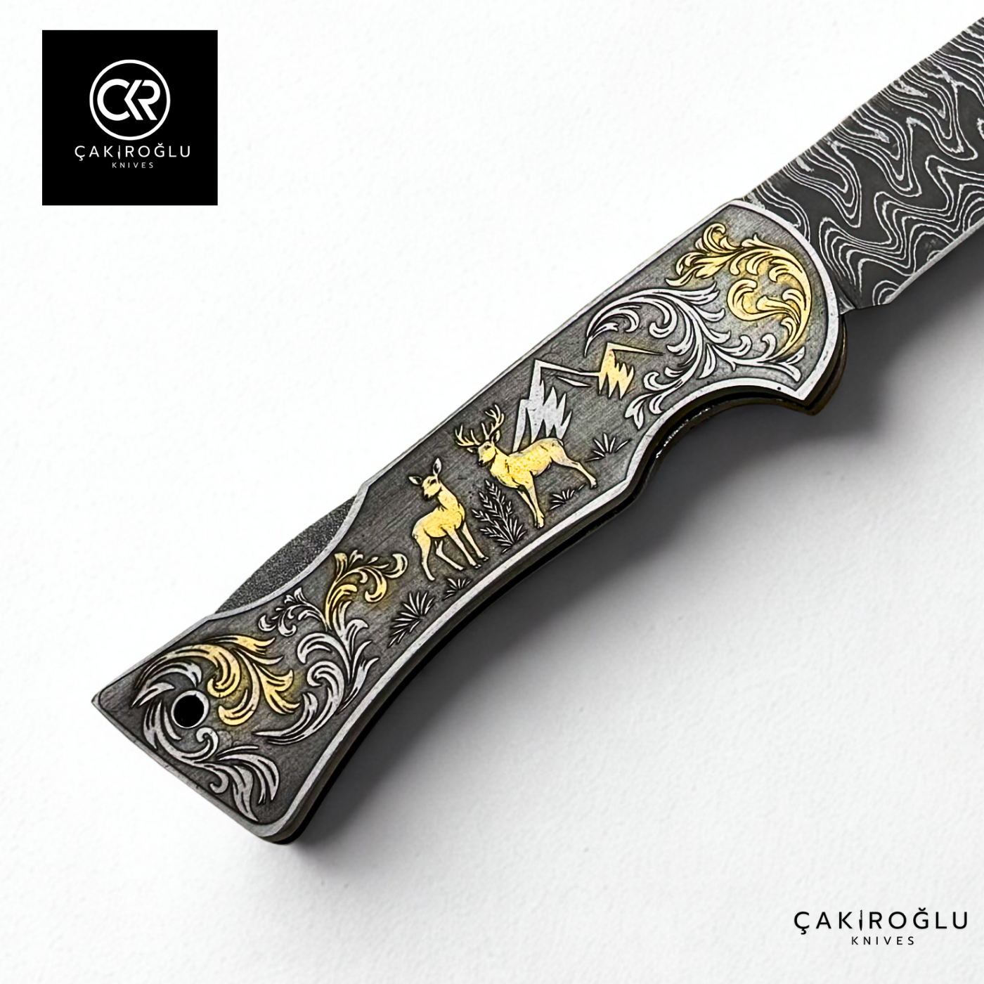 Corvus series Damascus - Limited Edition Collector's Folding Knife with 14K gold engraving details on a stainless steel case